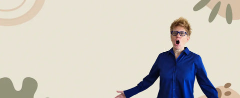 A woman wearing a vibrant blue button-up shirt and glasses.